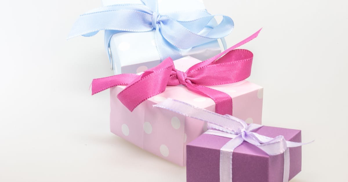 A trio of pastel gift boxes tied with vibrant ribbons, perfect for celebrations.