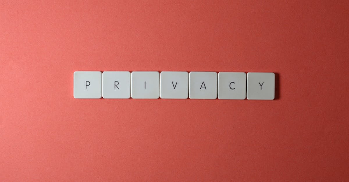 Close-up of letter tiles spelling PRIVACY on a red background, symbolizing data protection.