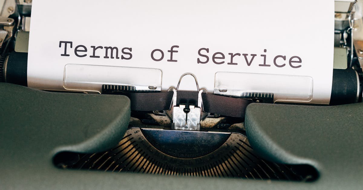 A vintage typewriter with a paper displaying 'Terms of Service'. Perfect for business or legal themes.